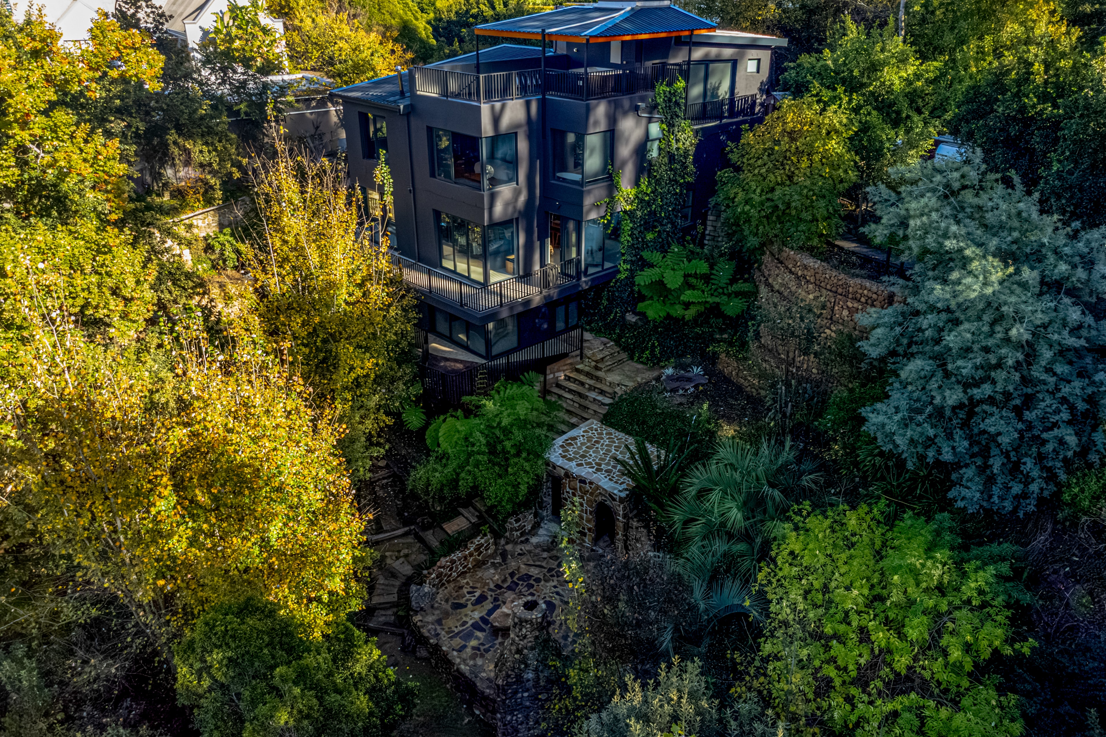 Forestfall aerial — stone gardens and terraces