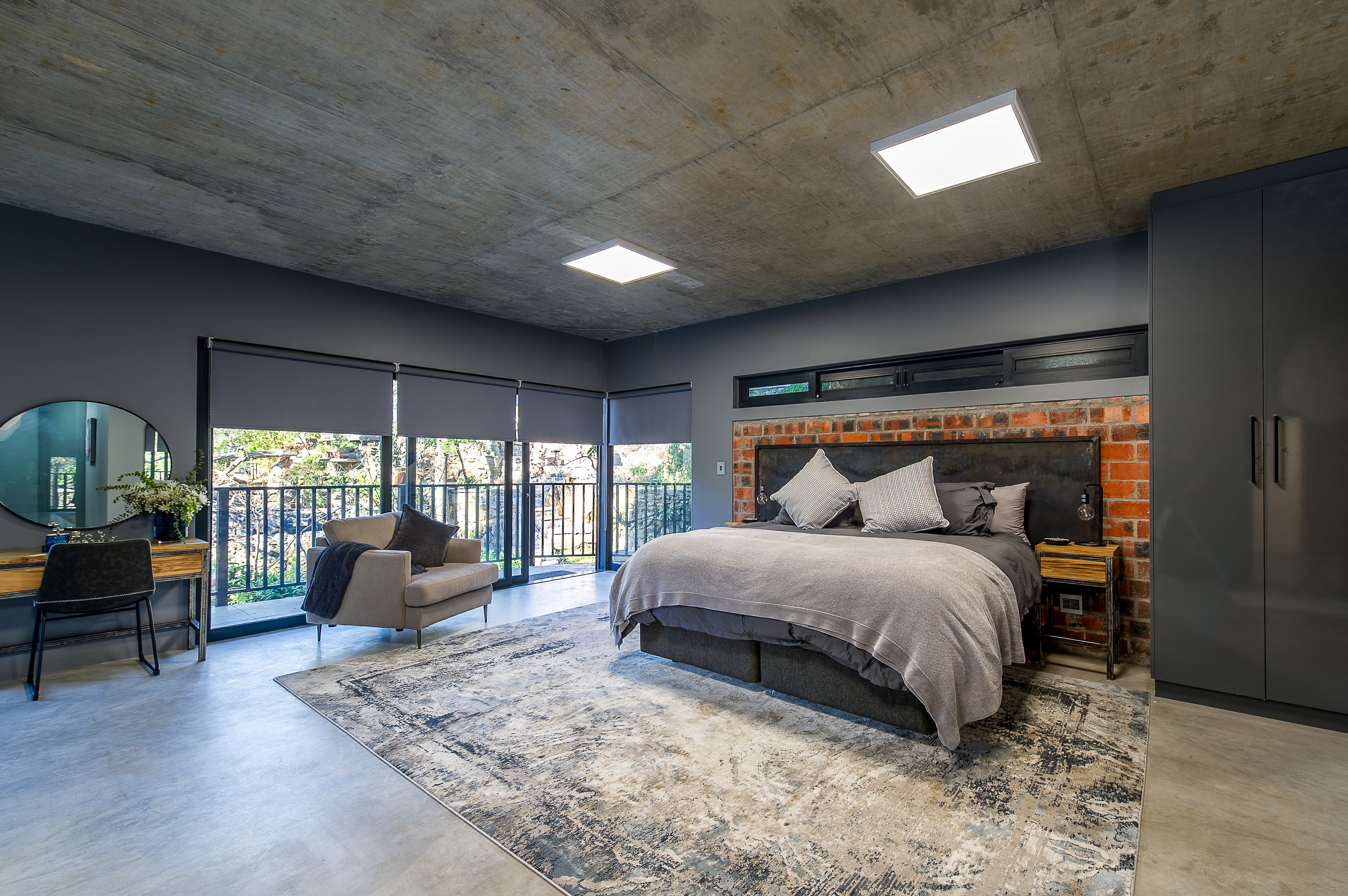 Master bedroom with balcony and forest views