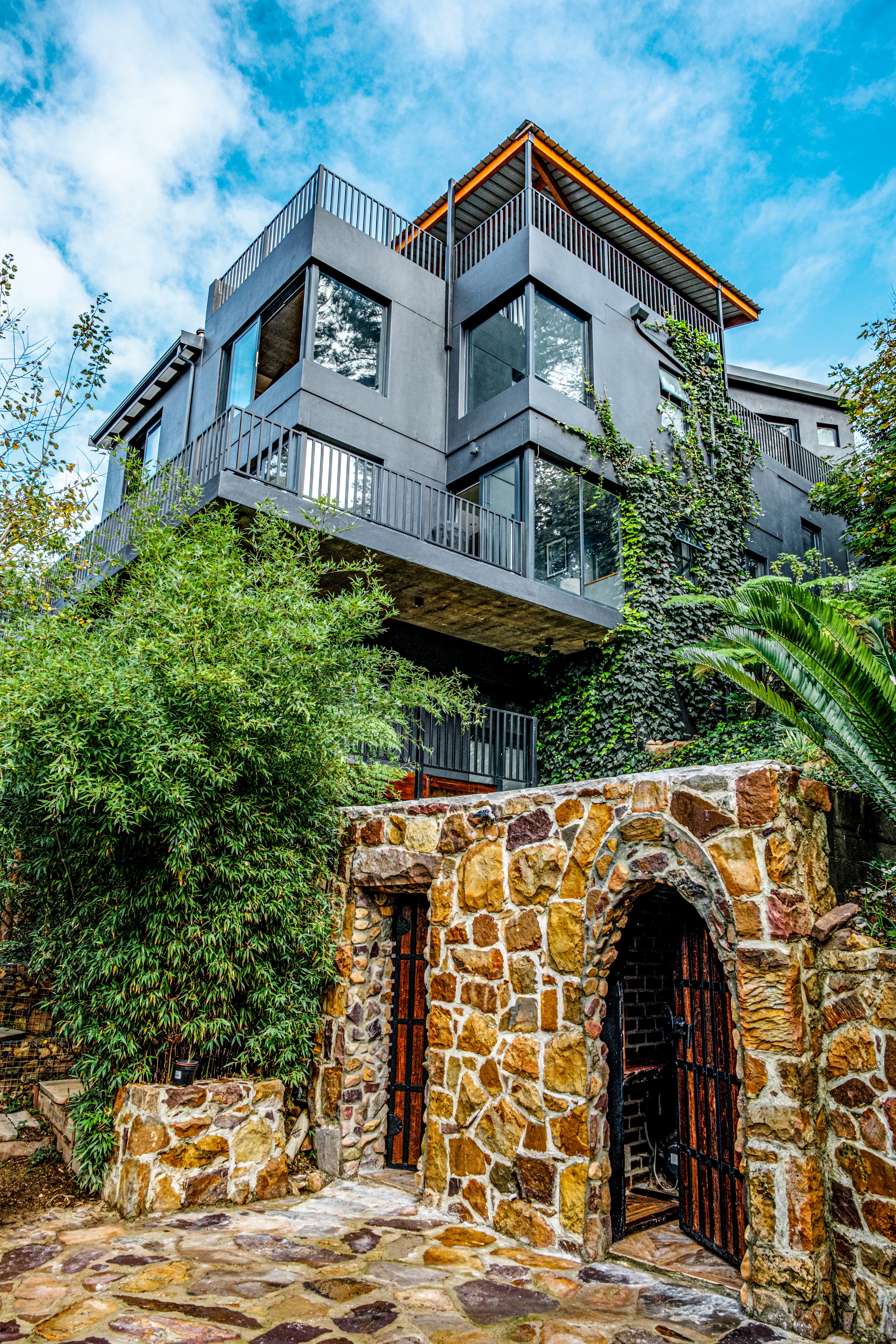 ForestFall — stone and charcoal architecture